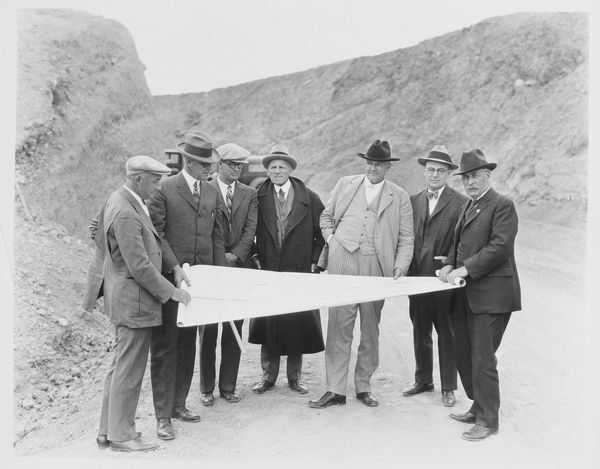 Harry Chandler and others inspect plans for Mulholland Dam, circa 1920